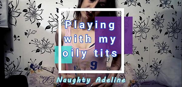  Naughty Adeline playing with her oily tits